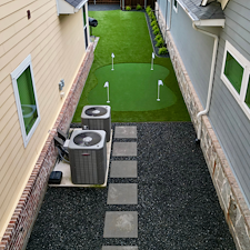 Backyard-Redesign-with-Artificial-Turf-Putting-Green-Landscape-Rock-Installation-in-McKinney-TX 14